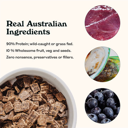 Wild Kangaroo & Grass Fed Lamb air-dried dog food pieces in a white bowl with real Australian ingredients — 90% wild-caught protein with green lipped mussel, 10% wholesome fruit, veg and seeds, zero preservatives or fillers
