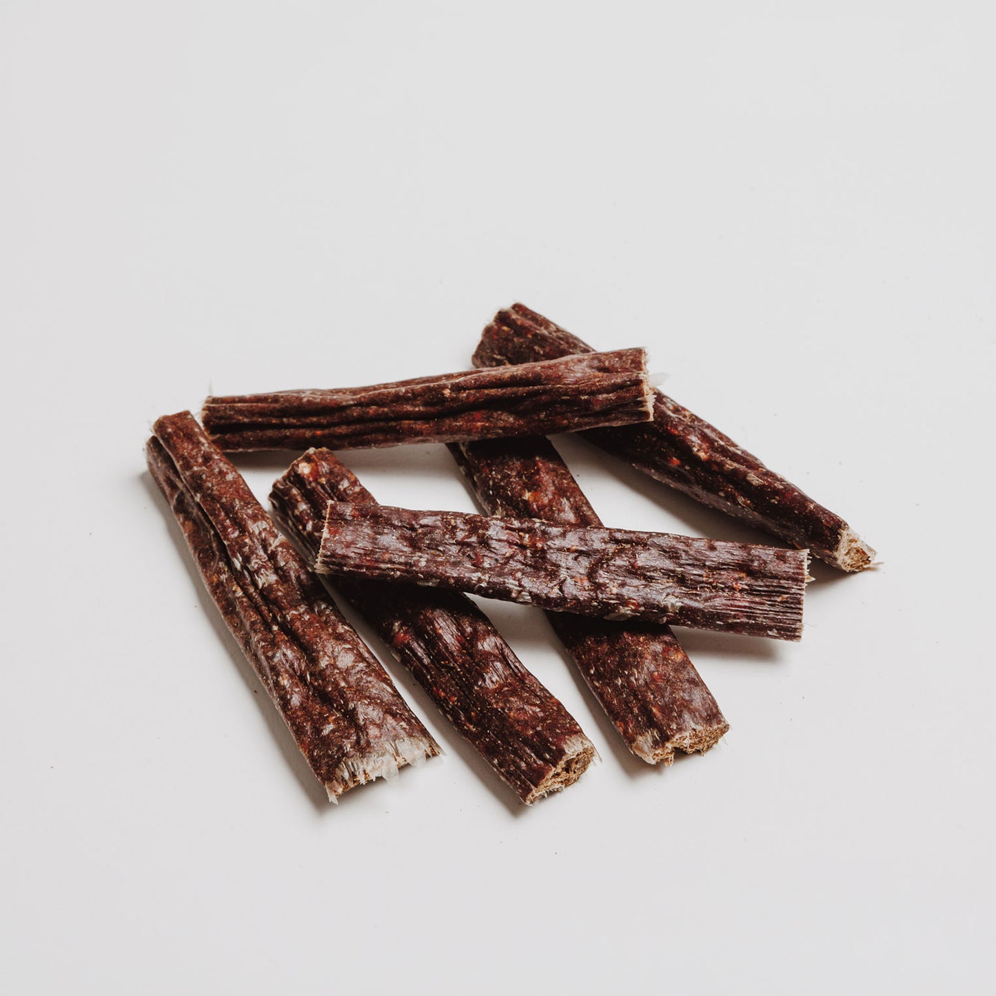 Close up of Eureka Breath Freshener natural dog treat sticks made with 75% wild venison, sweet potato, blueberry and mint for fresh dog breath